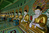 Myanmar - Sagaing hill, Umin Thounzeh (the 30 Caves), a colourful crescent-shaped colonnade within which there are 45 Buddha images. 